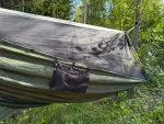 Mesh pocket hung under the edge of the hammock