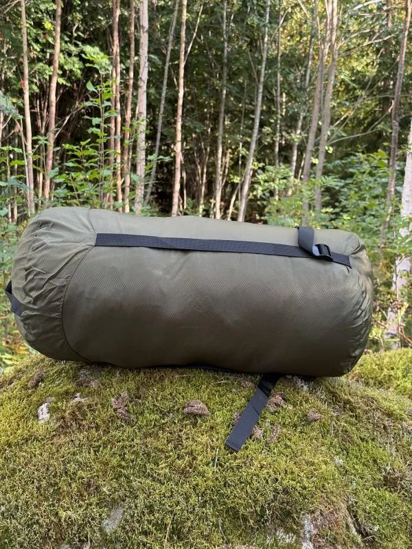 Compression sack lying down with the straps visible
