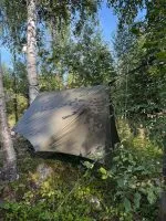 Winter tarp pitched, seen from above in birch forest
