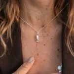 The 925 silver breathing necklace worn on a fine silver chain.
