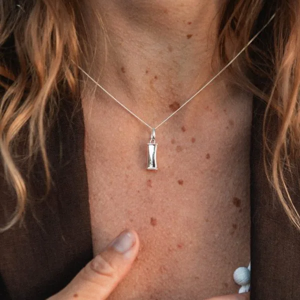 The 925 silver breathing necklace worn on a fine silver chain.